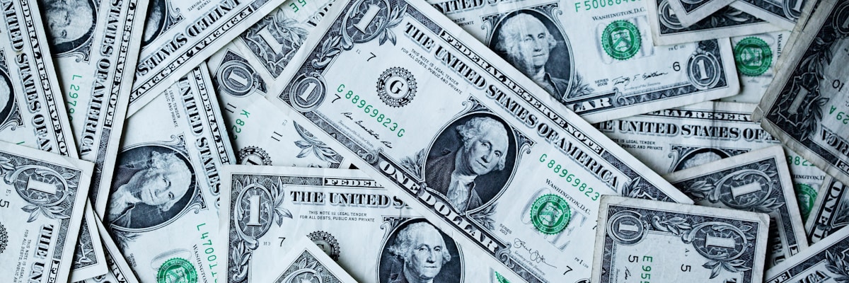 World map with dollar bills and financial concept